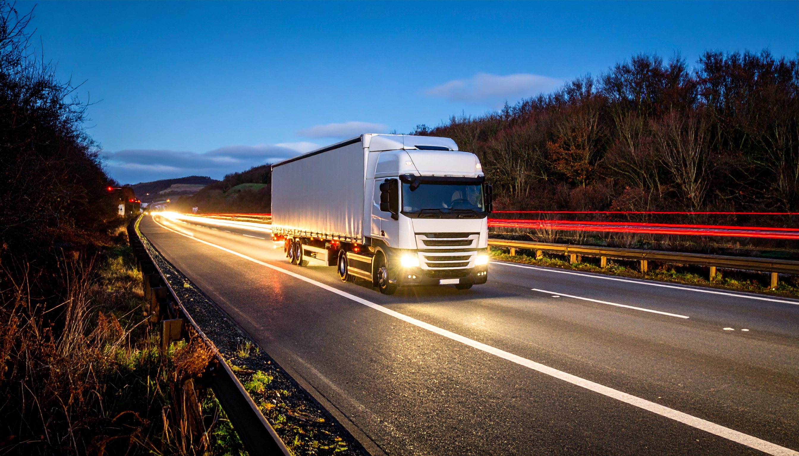 Modern HGV on a UK motorway at dawn